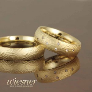 Gerstner wedding rings in structured yellow gold with diamonds 