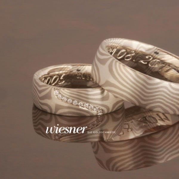 Bagassa Mokume wedding rings with diamonds in channel setting