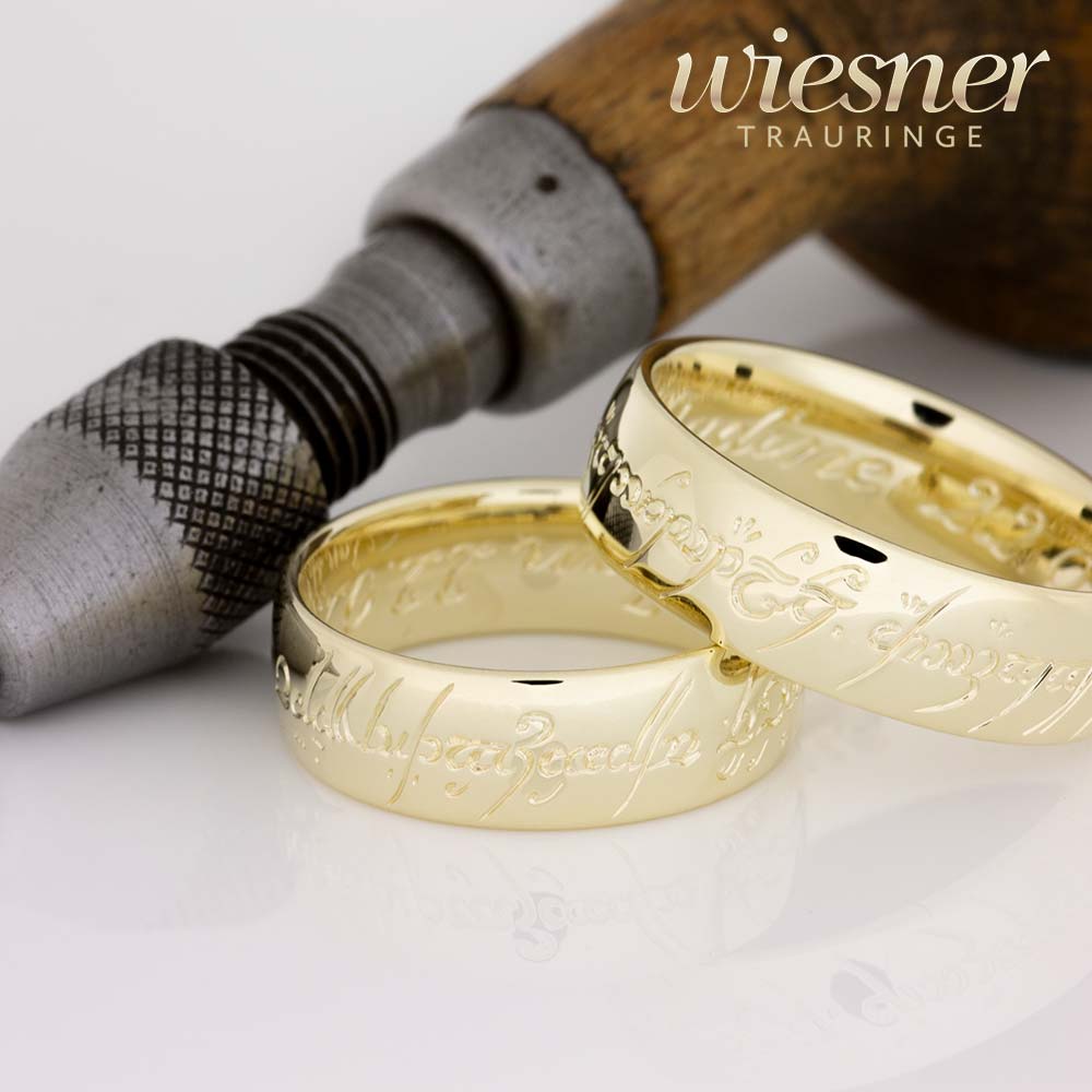 Wedding rings with extravagant elf writing