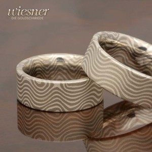Wedding rings hand forged in Tiama Mokume Gane