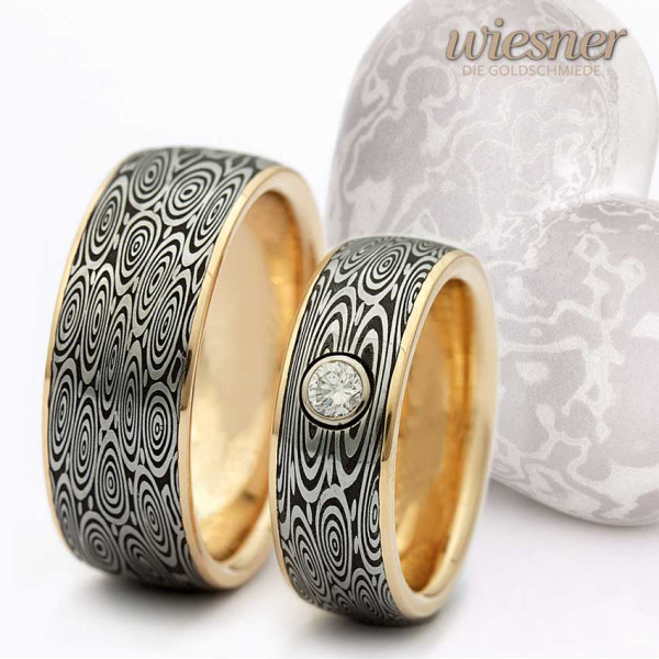 Damascus steel rings with yellow gold